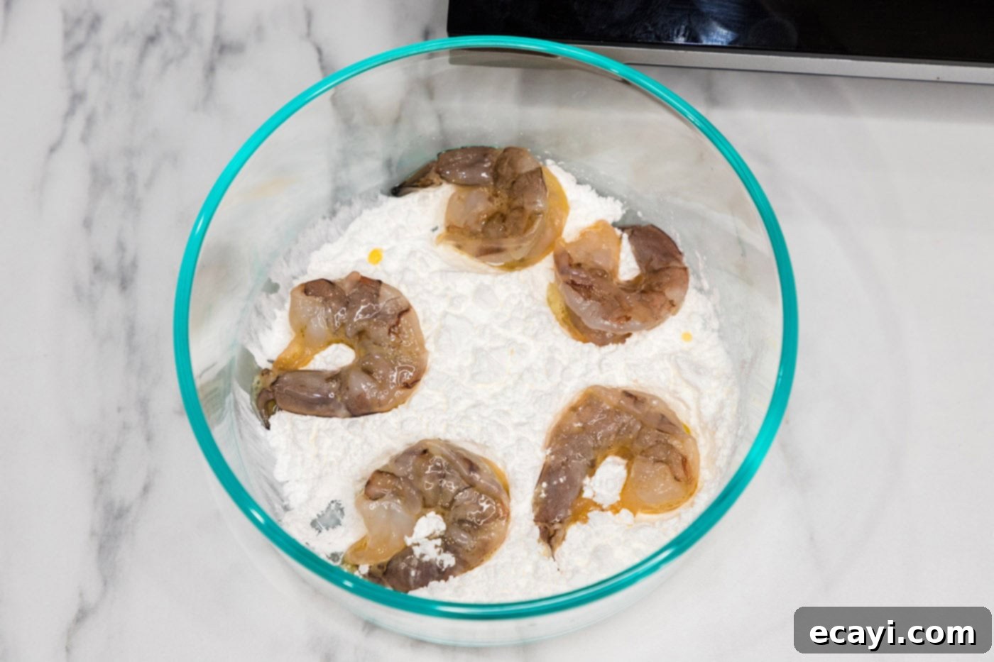 Glazed Mongolian Shrimp 6 dredged shrimp in flour in a bowl