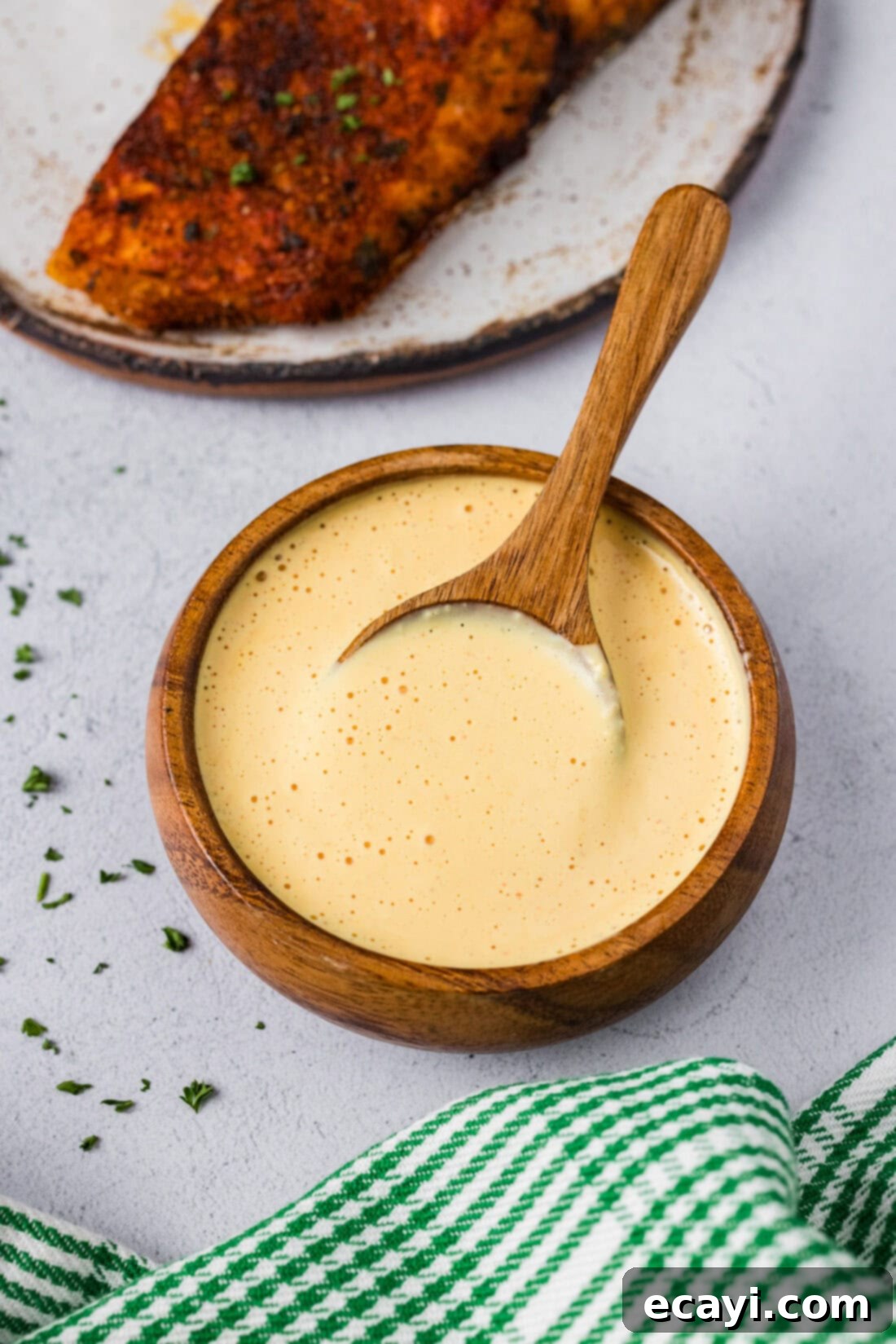 Classic Remoulade 7 A beautifully presented bowl of Remoulade Sauce with a spoon, showing its smooth, creamy texture and readiness to be served.