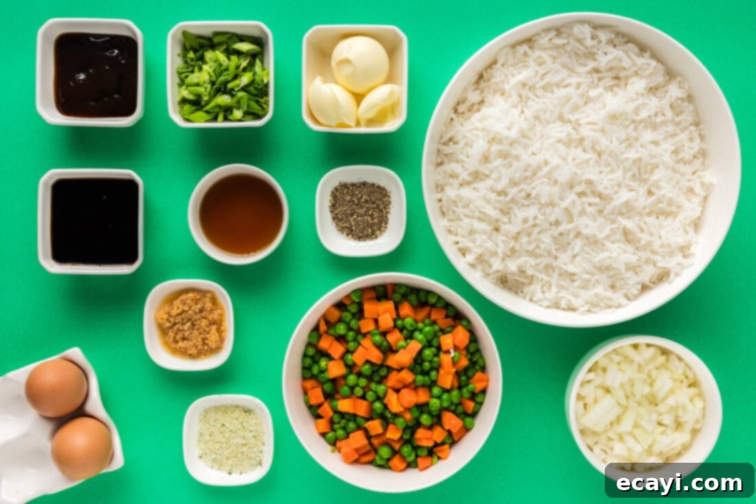 Golden Fried Rice Delights 4 Ingredients for Fried Rice laid out on a wooden board