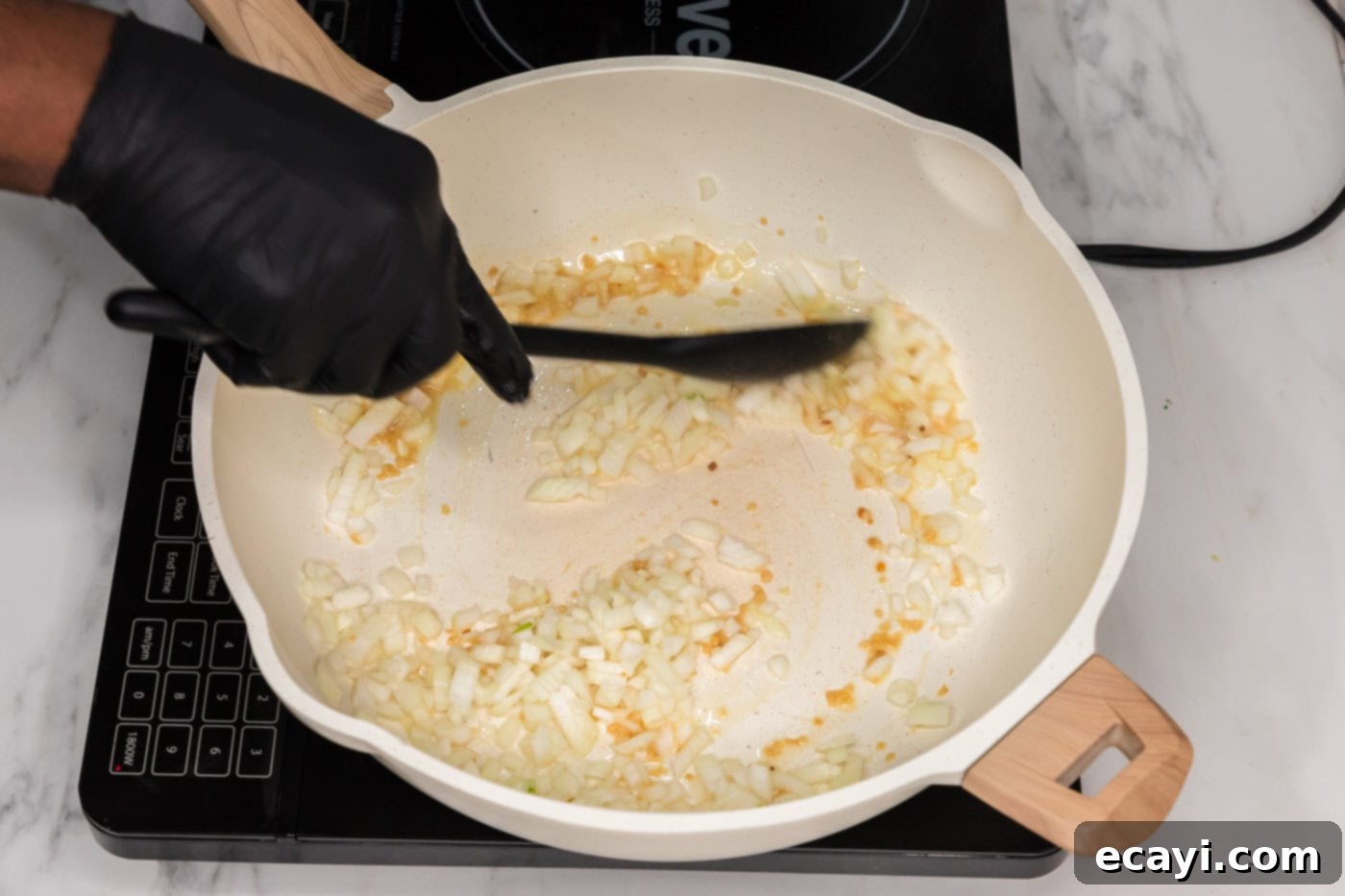 Golden Fried Rice Delights 5 Sautéing garlic and onion in a skillet for fried rice