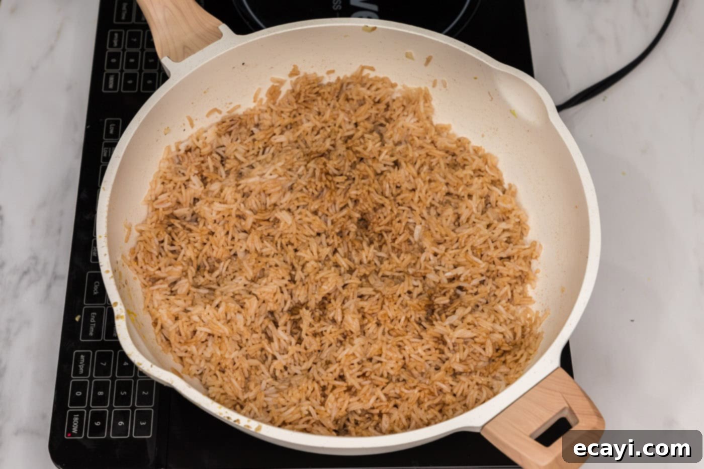 Golden Fried Rice Delights 10 Soy sauce and oyster sauce mixed with rice in a skillet, turning it savory