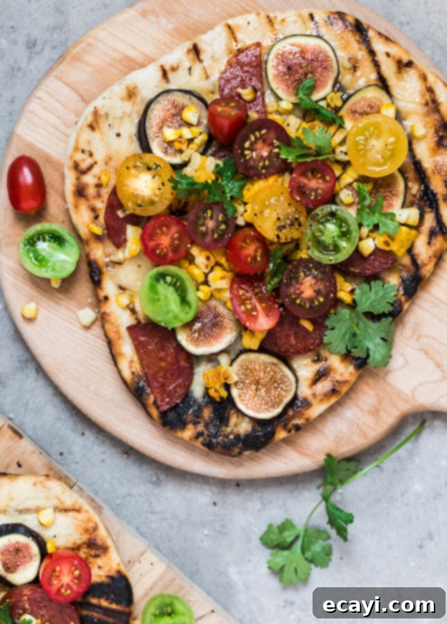 Smoky Sunset Pizza 2 Vibrant Late-Summer Grilled Pizza with figs, cherry tomatoes, and corn on a crispy crust, a perfect BBQ recipe from Christelle is Flabbergasting // FoodNouveau.com