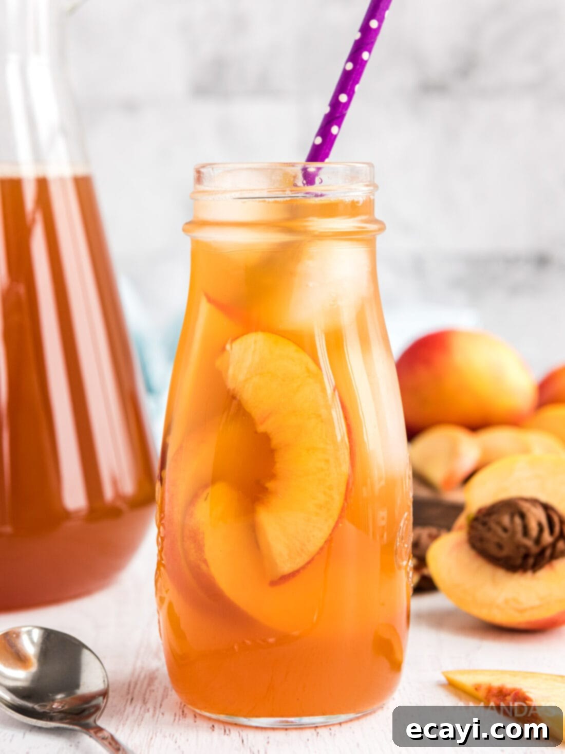 Sun-Kissed Peach Brew 8 A glass bottle filled with delicious peach iced tea.