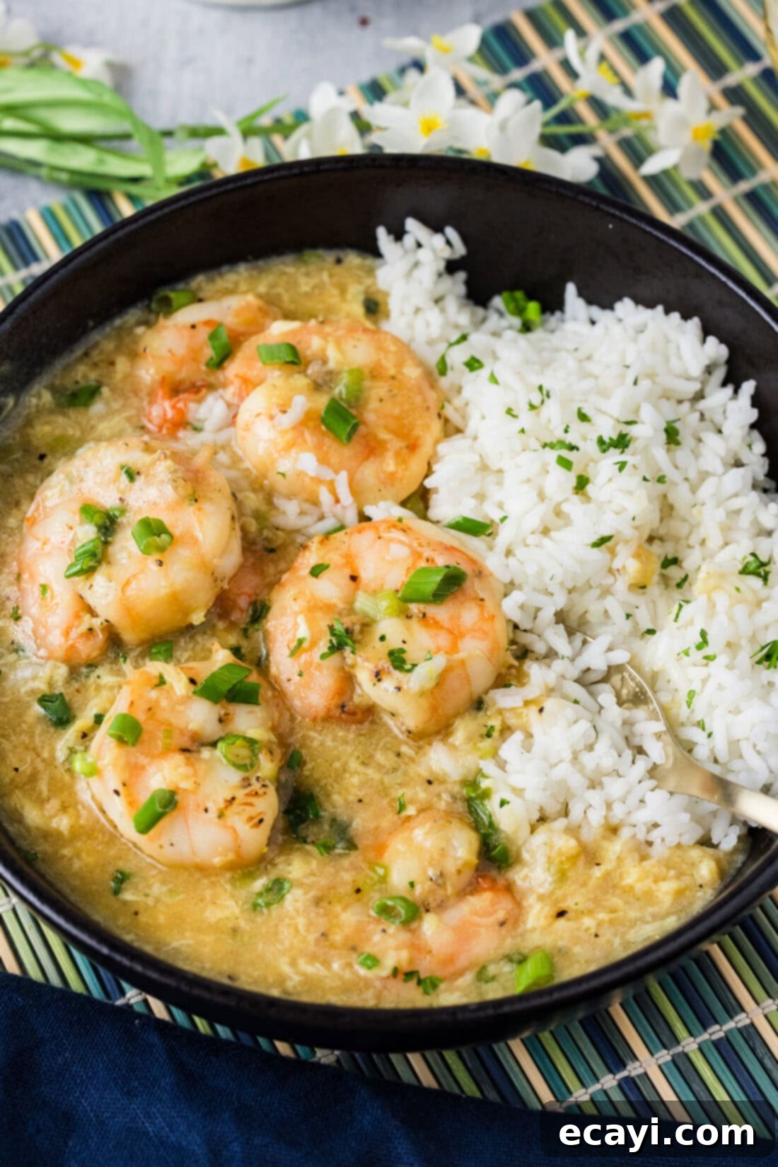 Velvety Lobster Sauce Shrimp 3 Close up photo of a bowl of white rice and perfectly cooked Shrimp with Lobster Sauce, highlighting the rich texture