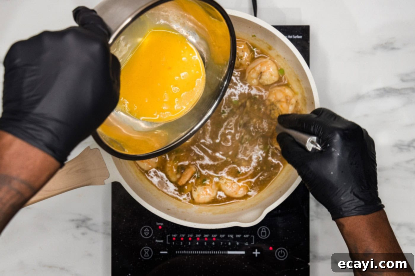 Velvety Lobster Sauce Shrimp 9 Whisking the egg mixture into the skillet with shrimp and sauce, creating delicate egg ribbons