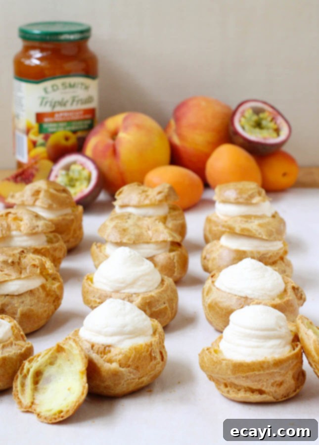 Çarkıfelek, Kayısı ve Şeftalili Ekler 5 Close-up of an assembled Peach Cream Puff, showing the fluffy choux and fruit topping