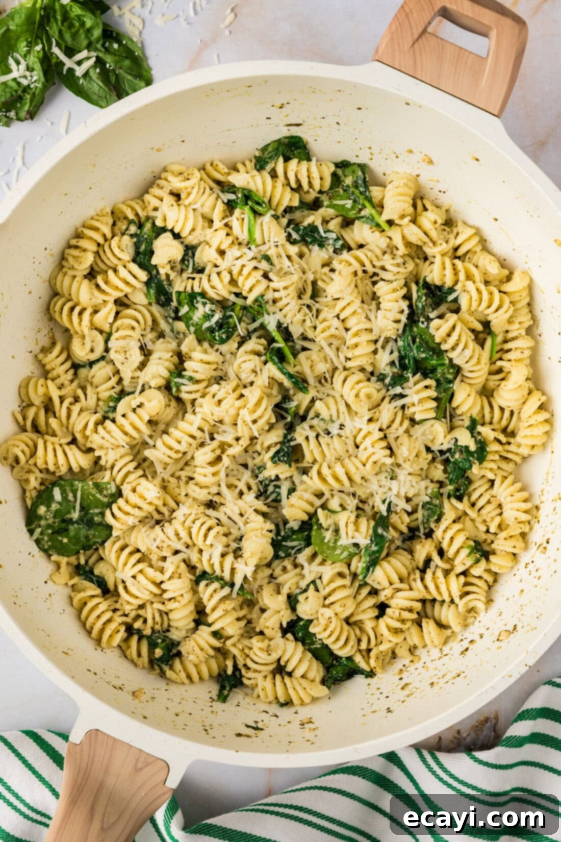 Pesto Perfection 9 Close up photo of a skillet of Pesto Pasta, showcasing the vibrant green sauce and tender pasta