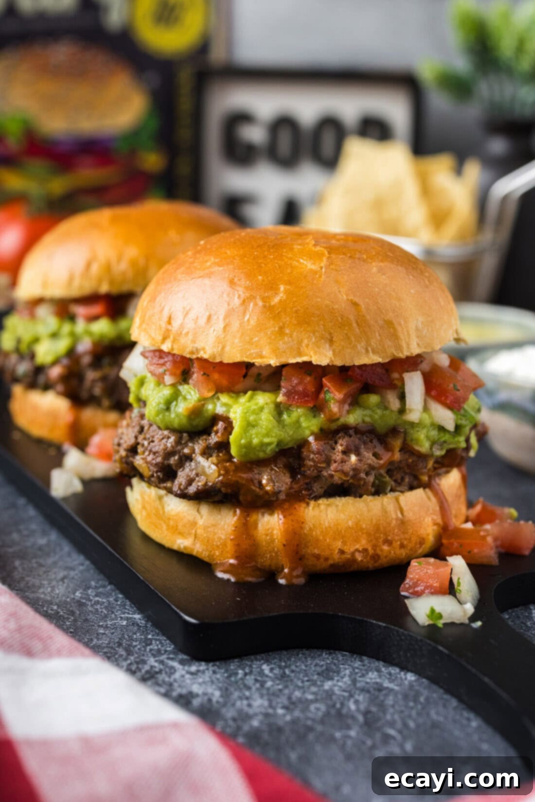 Taco Burger Fusion 2 Two Taco Burgers on a platter, showcasing their delicious toppings and juicy patties.