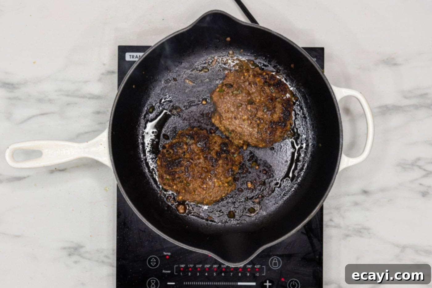 Taco Burger Fusion 9 Perfectly cooked taco burger patties, removed from the skillet and ready to be assembled.
