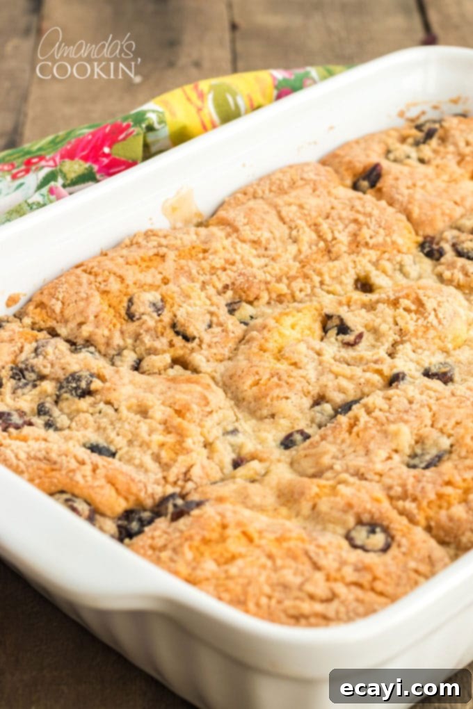 Fall is all about apples and cranberries. We love our apple cobbler all year long, but reserve this Cranberry Apple Cobbler for the autumn months. baked apple cranberry cobbler in 13x9 pan