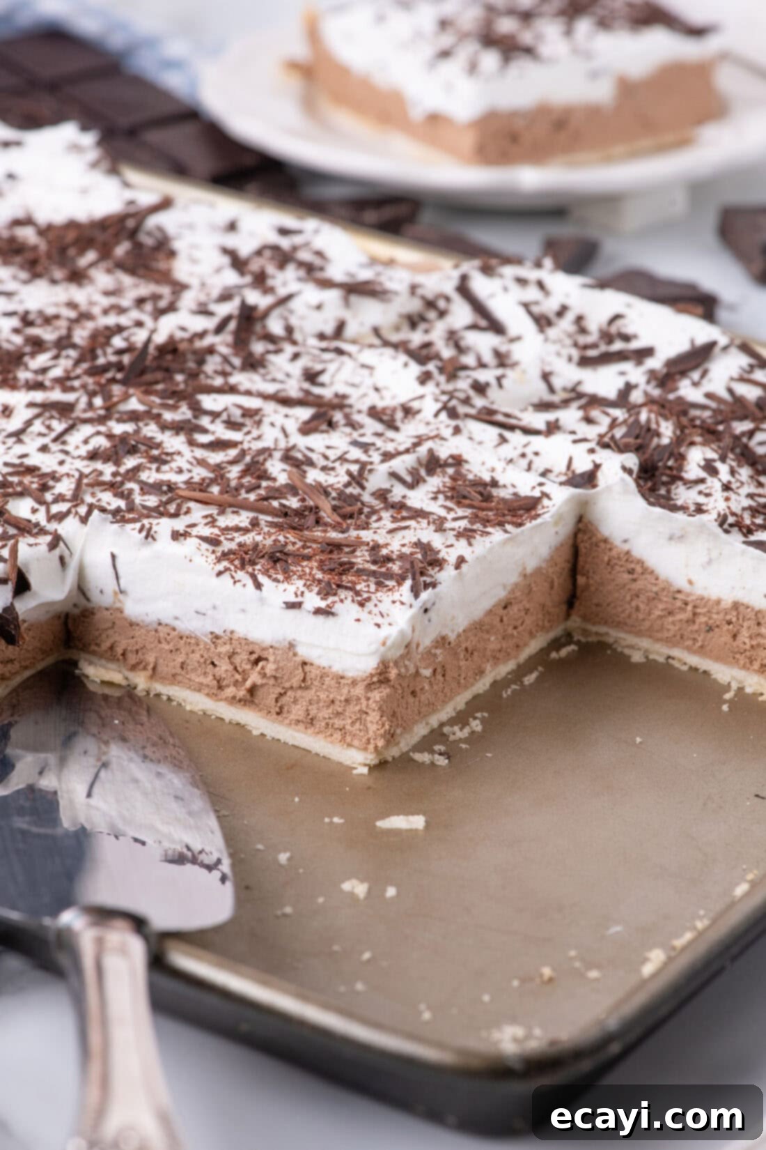 Ultimate French Silk Sheet Pie 17 Close up photo of a French Silk Slab Pie with slices removed, showing perfect layers