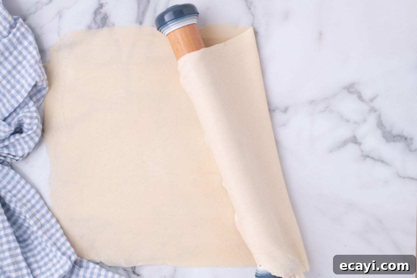 Ultimate French Silk Sheet Pie 6 draping pie crust over rolling pin for easy transfer