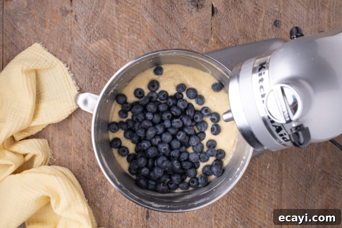 Zesty Lemon Blueberry Bliss 8 Fresh blueberries gently folded into the lemon cake batter in a mixer bowl