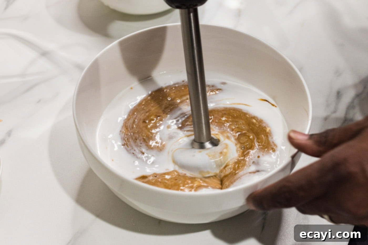 Tropical Coconut Chicken 7 blitzing coconut sauce ingredients with an immersion blender