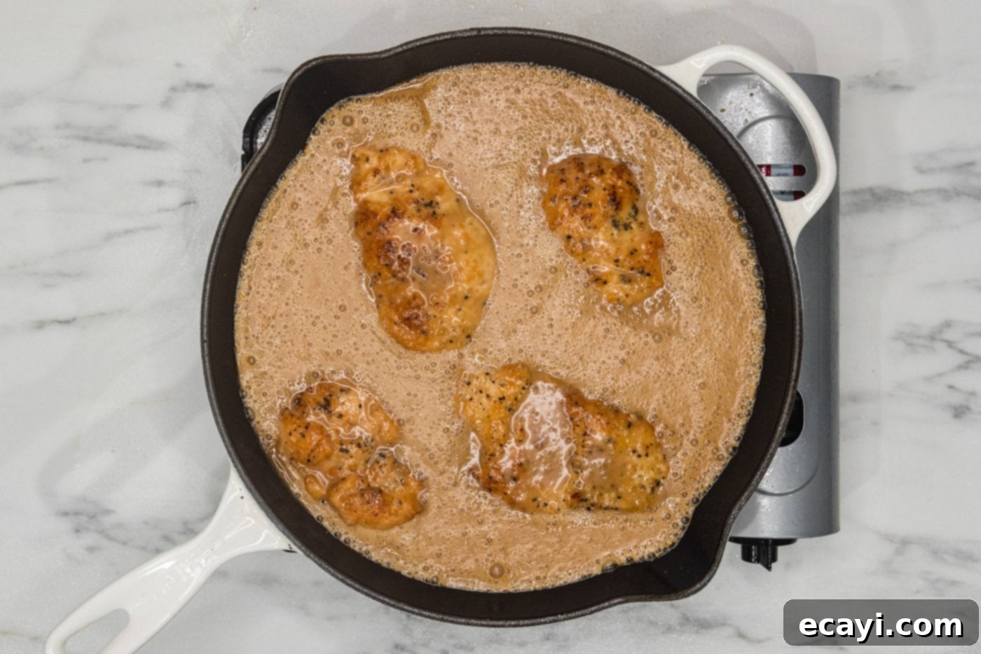 Tropical Coconut Chicken 9 coconut chicken in a skillet