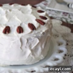 Southern Hummingbird Cake 10 A delicious three-layer Hummingbird Cake with cream cheese frosting, garnished with pecans.