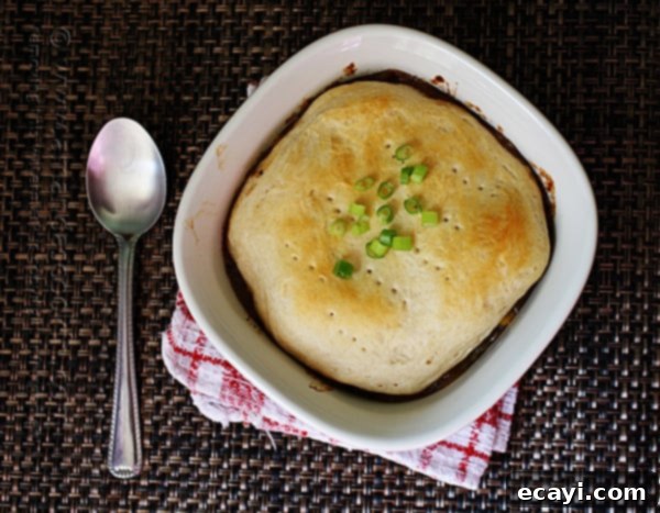 Homestyle Beef Biscuit Pot Pie 4 A selection of fresh ingredients laid out, including beef stew meat, flour, herbs, olive oil, coffee, beef broth, water, chopped potatoes, carrots, and mushrooms, ready for making Beef Stew Biscuit Pot Pie.