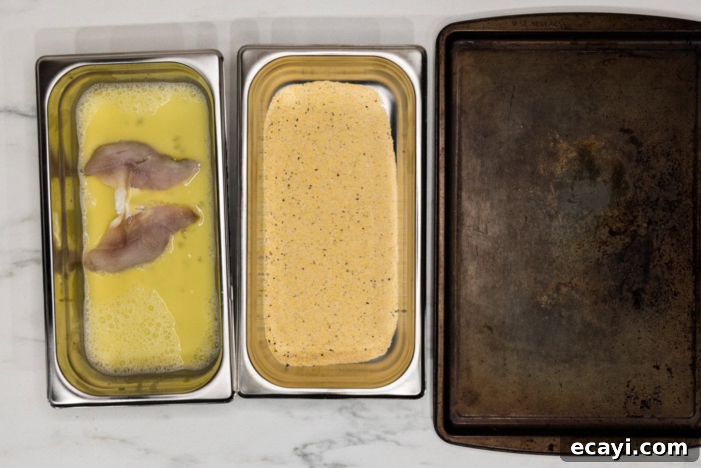 Golden Crispy Perch 5 perch filets in egg mixture in a breading tray