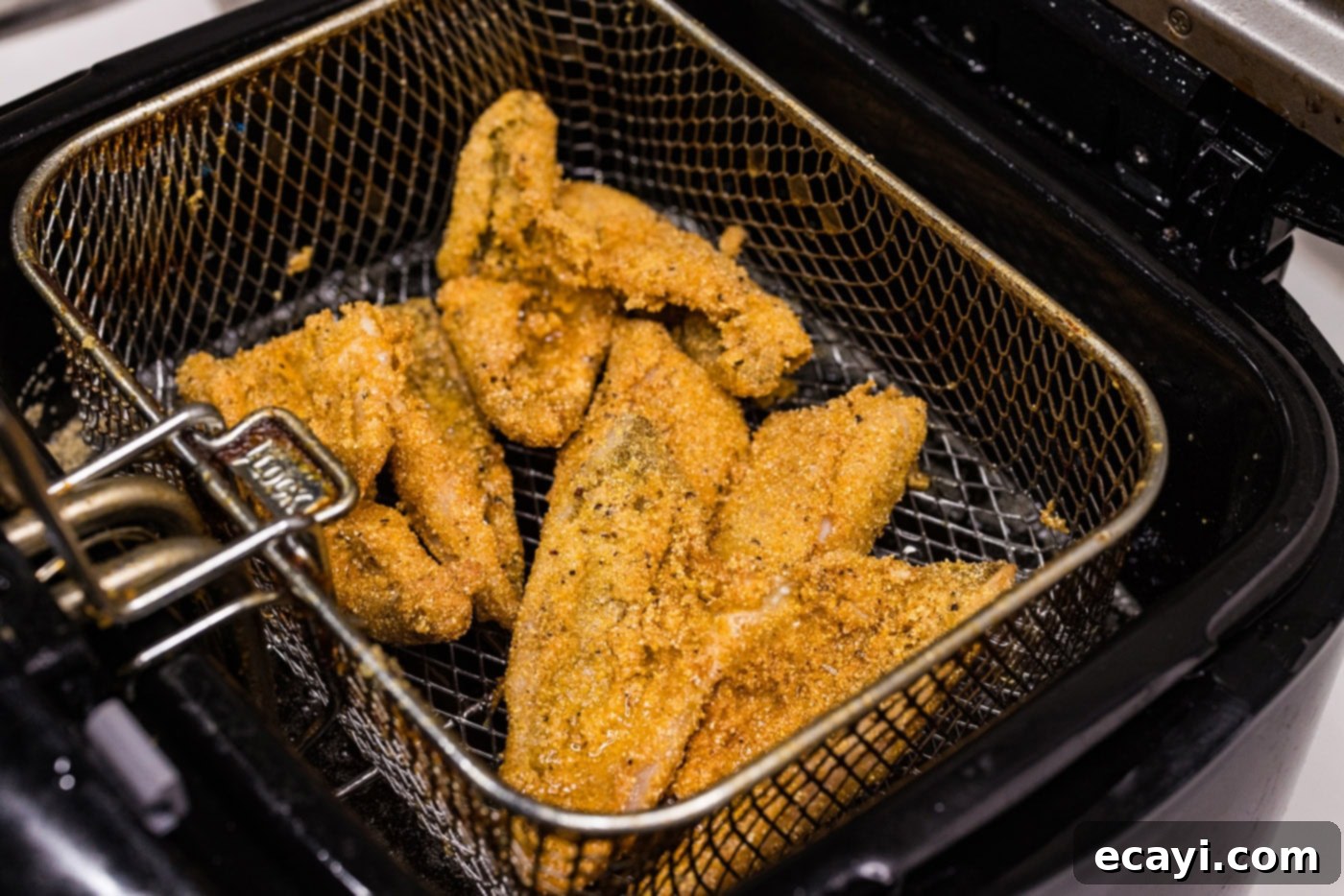 Golden Crispy Perch 7 fried perch in a deep fryer basket