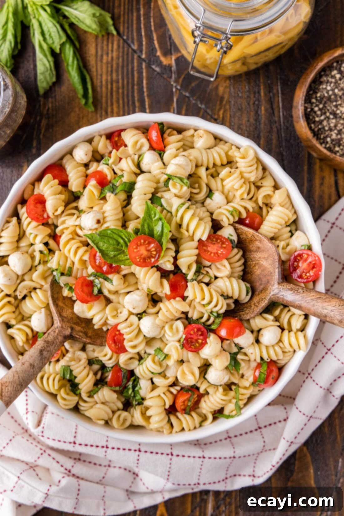 Caprese Pasta Delight 3 Bowl of Caprese Pasta Salad, ready to be served at a summer gathering.