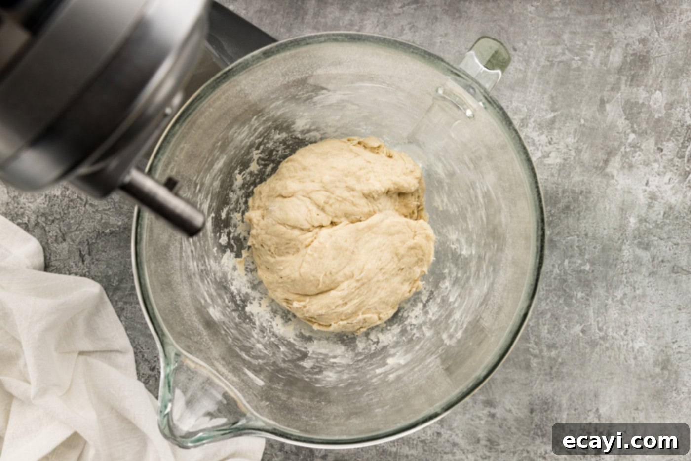 Endless Warm Garlic Breadsticks 8 Soft breadstick dough in a mixer bowl after mixing, showing its texture.
