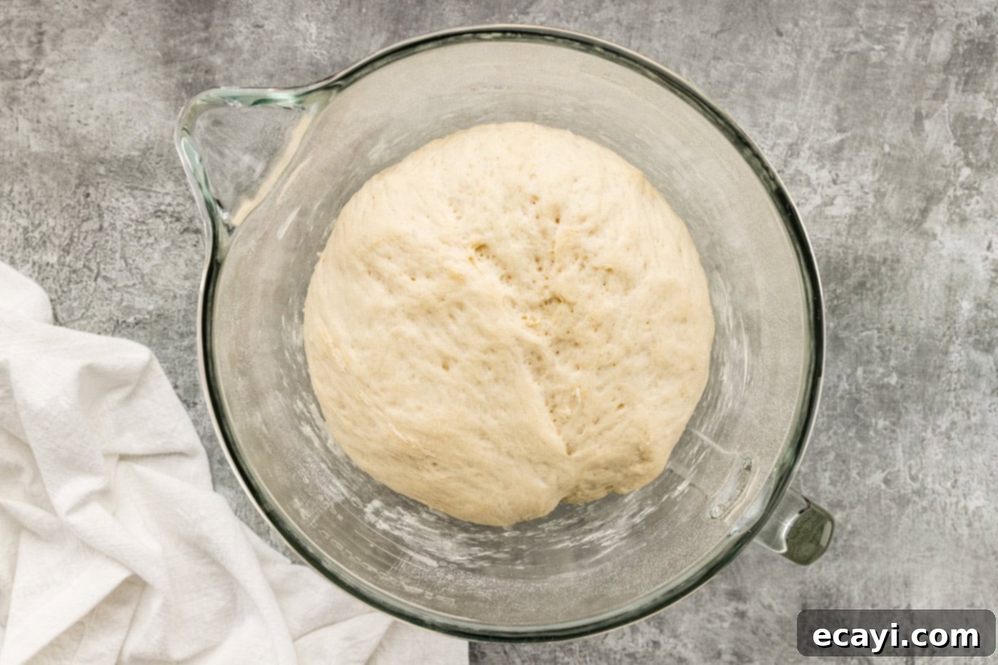Endless Warm Garlic Breadsticks 9 Breadstick dough perfectly risen and doubled in size in a bowl, ready for the next step.