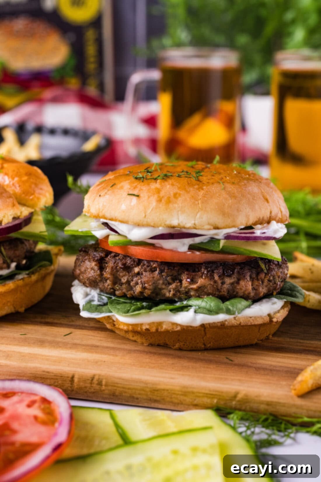 Crafted Lamb Burgers 3 A perfectly cooked lamb burger on a rustic wooden board, ready to be assembled