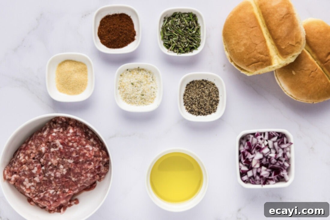 Crafted Lamb Burgers 4 A flat lay photograph showing all the fresh and dry ingredients required for making lamb burgers, including ground lamb, onions, garlic, rosemary, and spices