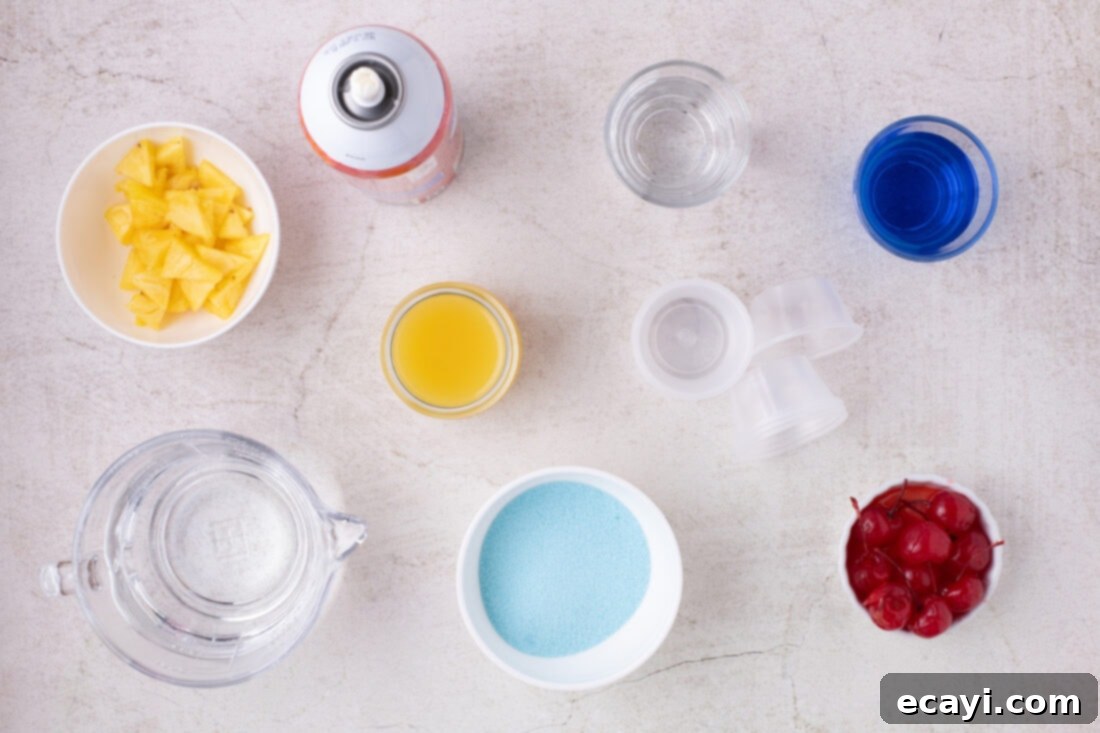 Blue Lagoon Jello Shooters 4 A flat lay photograph of the ingredients for Blue Hawaiian Jello Shots, including a box of Jell-O, bottles of coconut rum and blue curacao, and fresh pineapple juice.