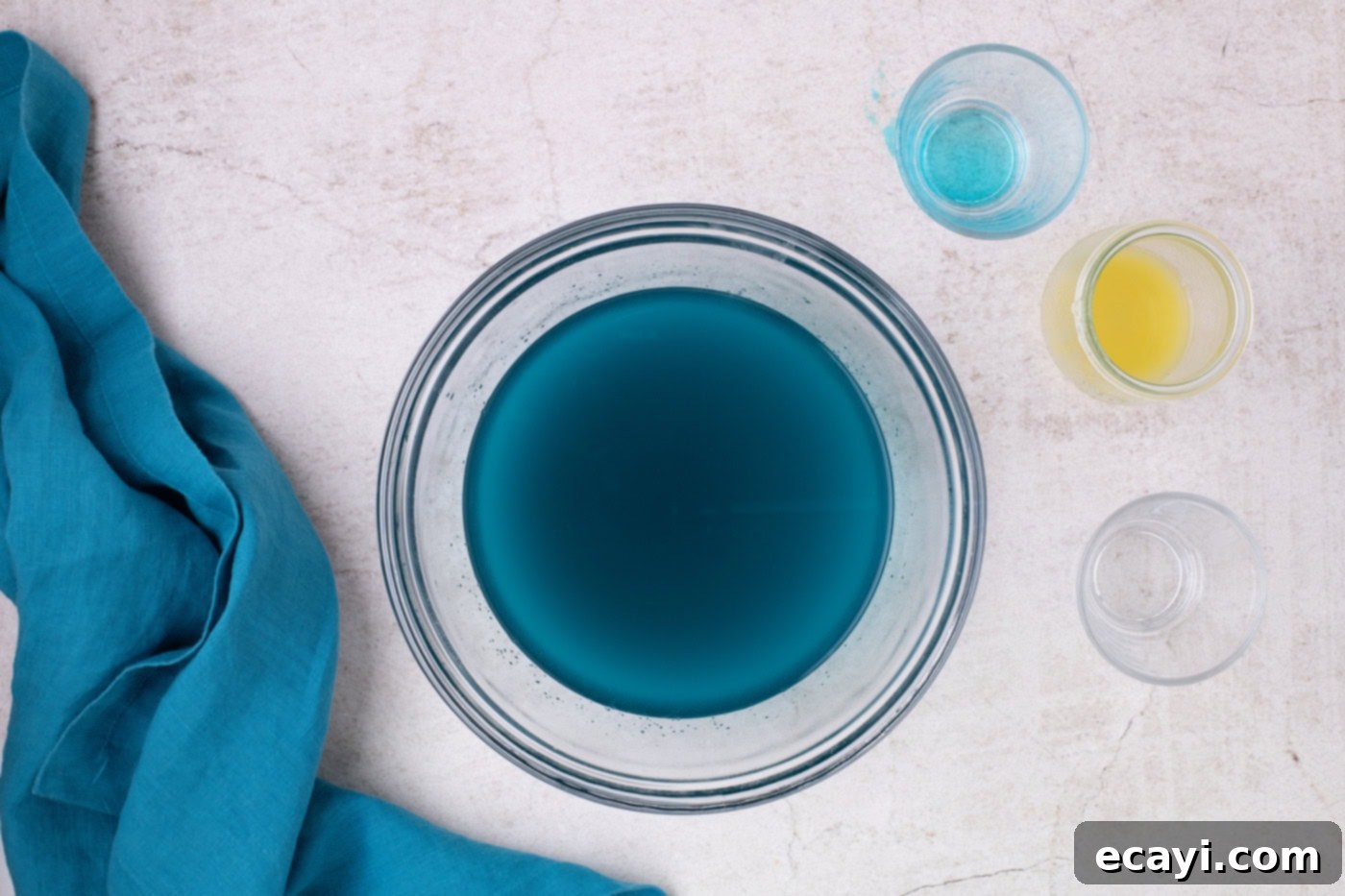 Blue Lagoon Jello Shooters 6 blue jello powder mixed with water in a bowl