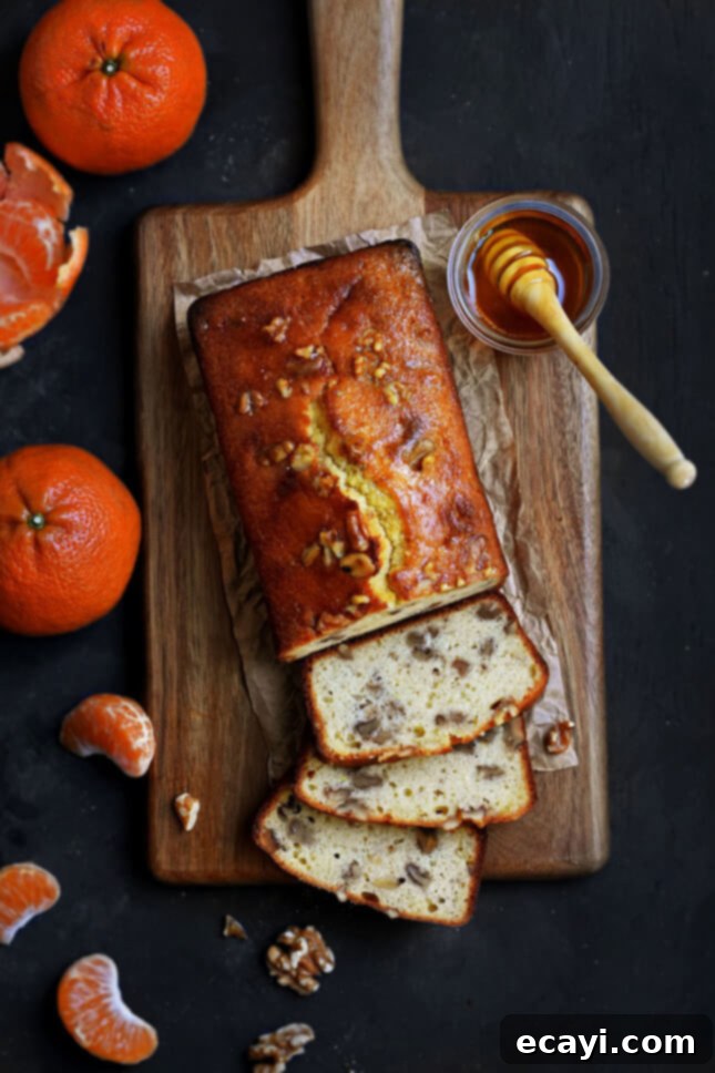 Honey-Kissed Tangerine Walnut Cake 4 A whole Tangerine, Honey, and Walnut Cake on a cooling rack, freshly baked, by Pardon Your French // FoodNouveau.com