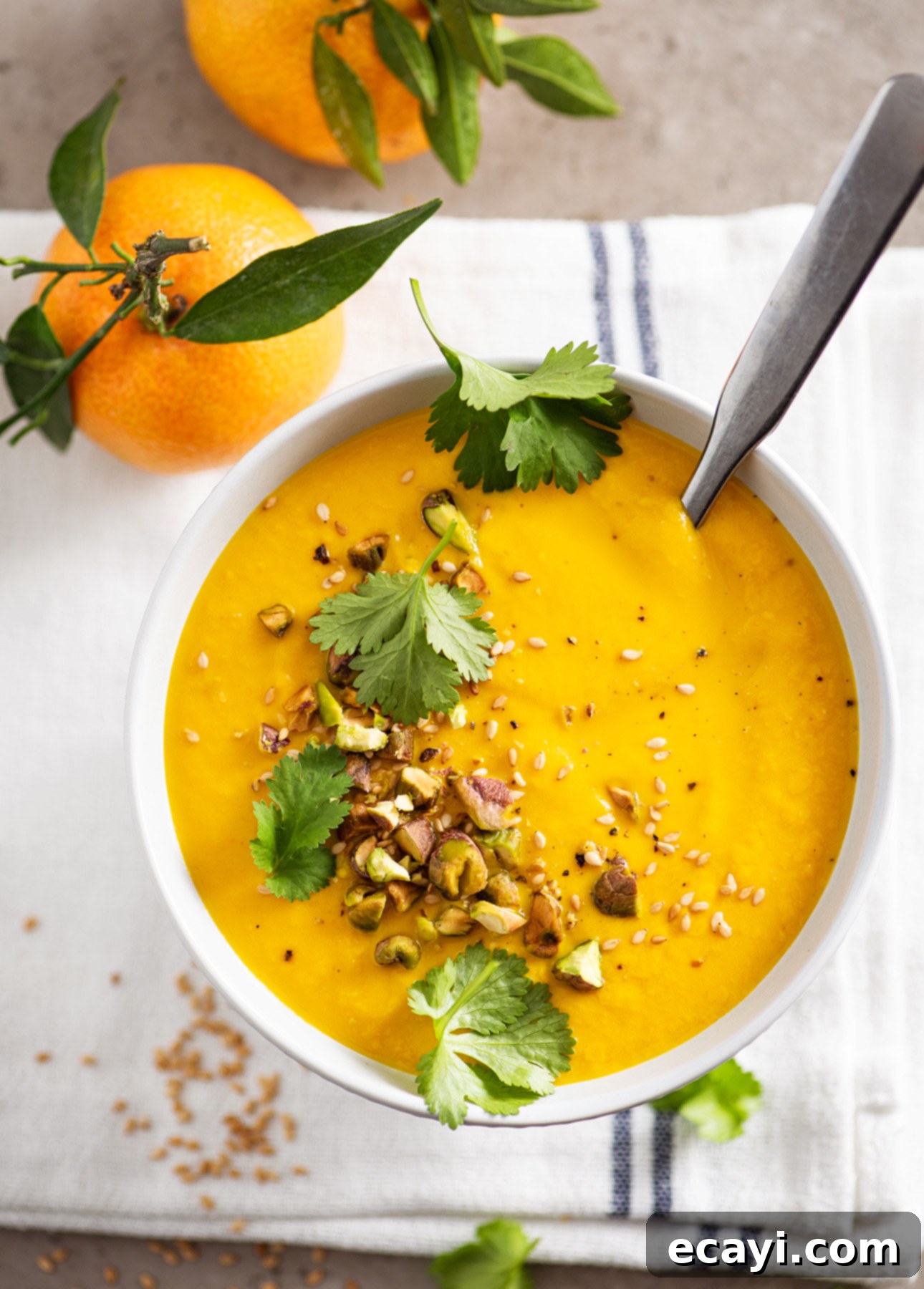 Velvety Golden Carrot Soup 4 Healthy, Bright & Dairy-Free Orange Carrot Soup // FoodNouveau.com - Another angle of the vibrant orange carrot soup, highlighting its rich color and inviting texture.