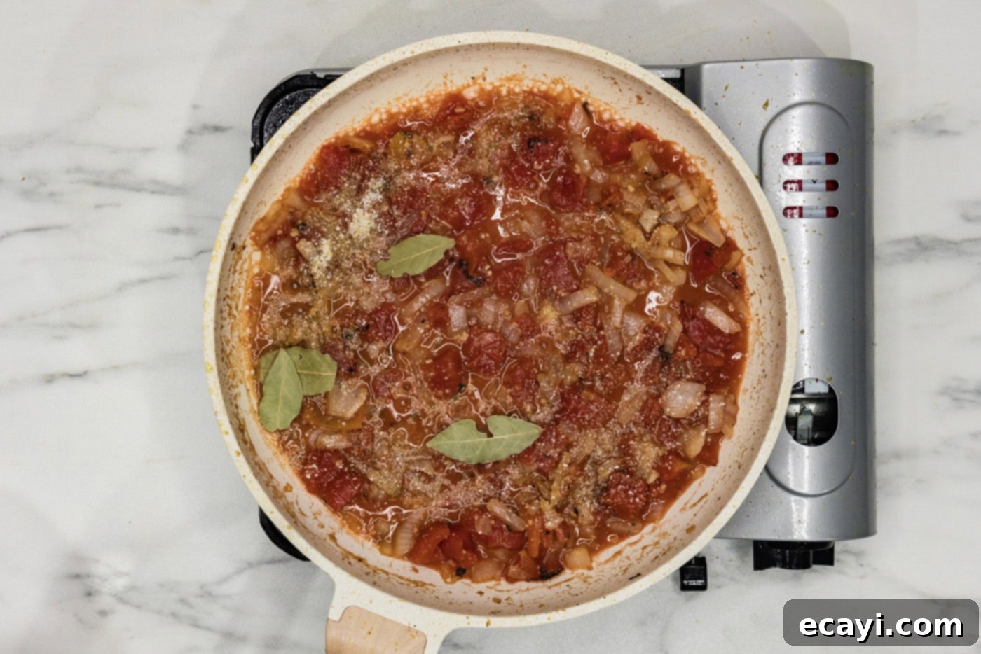 Tender Beef Curry 7 Tomatoes, white wine, and bay leaves added to the skillet with sautéed aromatics