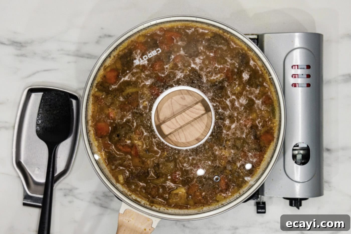 Tender Beef Curry 9 Beef curry simmering gently in a covered skillet on the stovetop