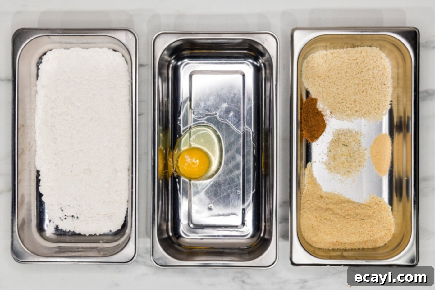 Crispy Fish Sliders 5 breading trays with flour mixture, egg, and panko mixture
