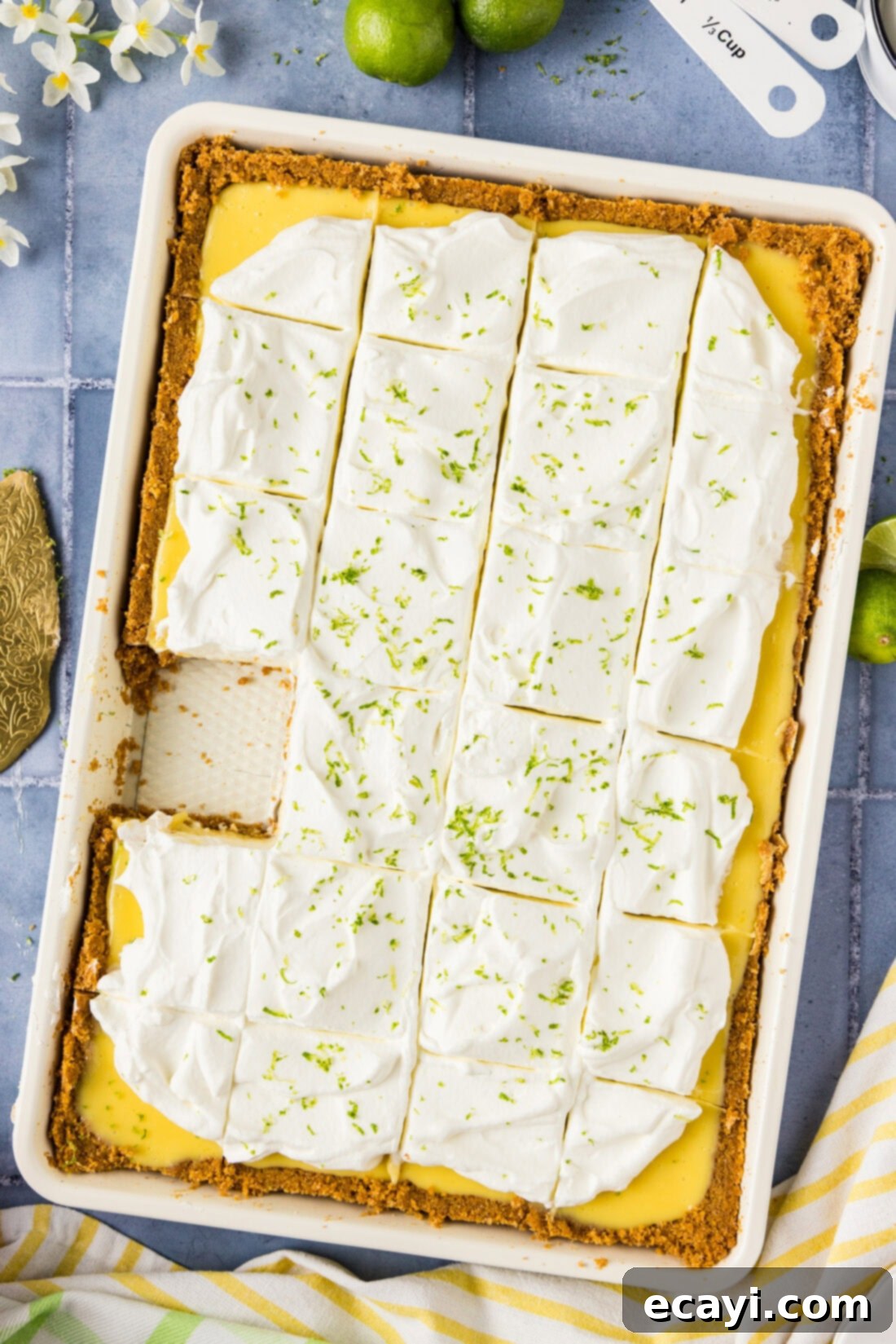 Tangy Key Lime Dessert Bars 11 Key Lime Slab Pie cut into slices with a slice removed