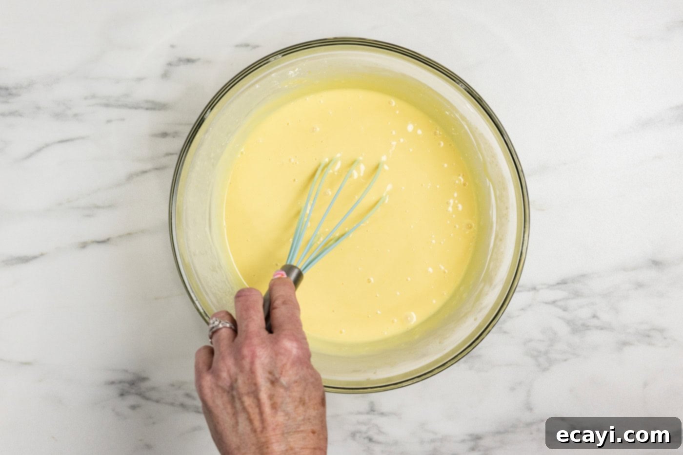 Tangy Key Lime Dessert Bars 8 whisking key lime pie filling in a bowl