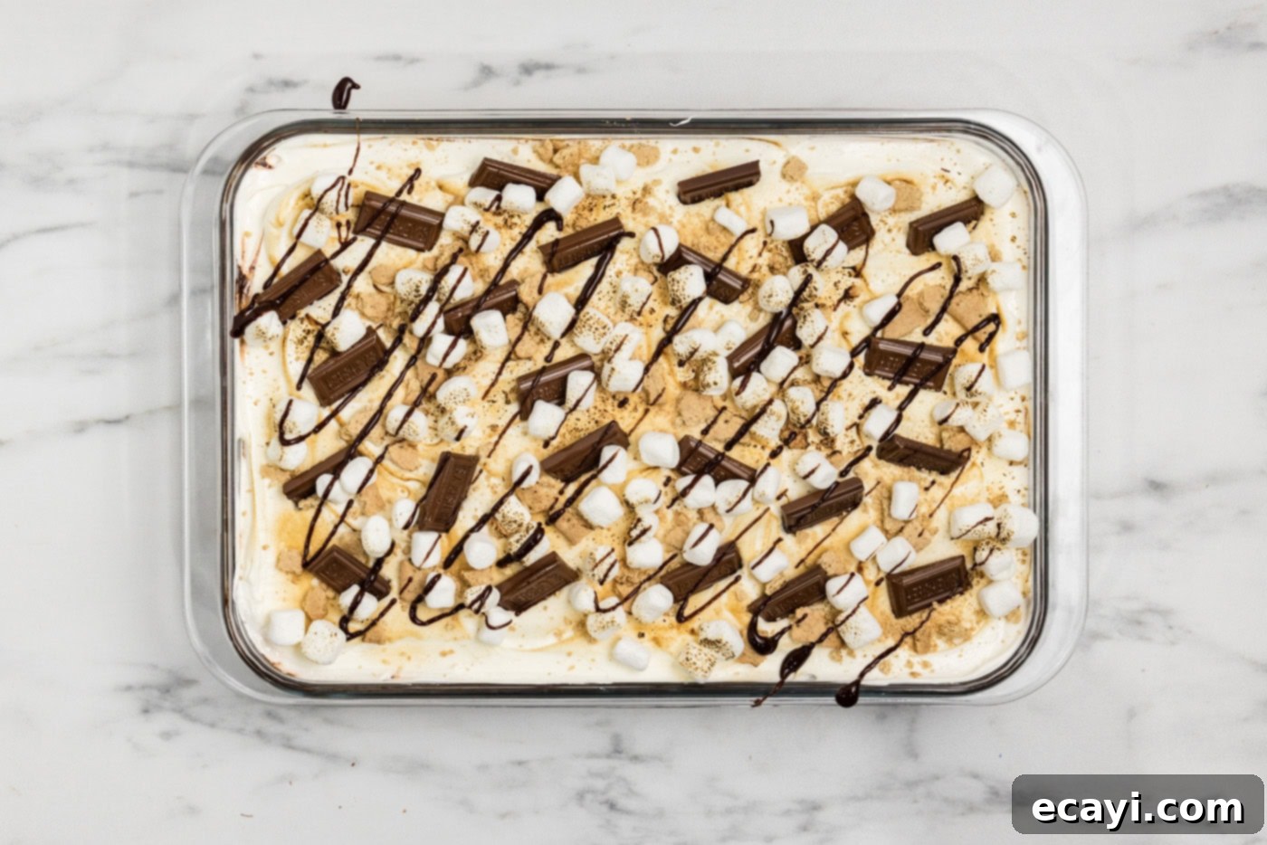 S'mores Lasagna 11 overhead shot of smores lasagna with chocolate bars and mini marshmallow garnish