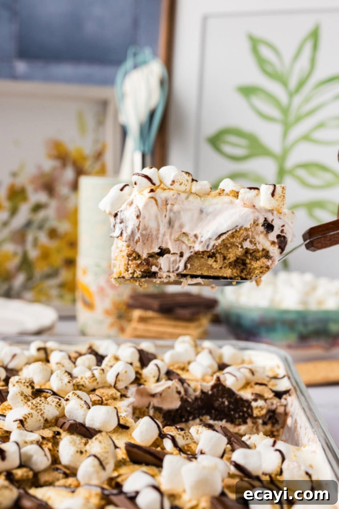 S'mores Lasagna 3 Slice of S'mores Lasagna being lifted out of the pan