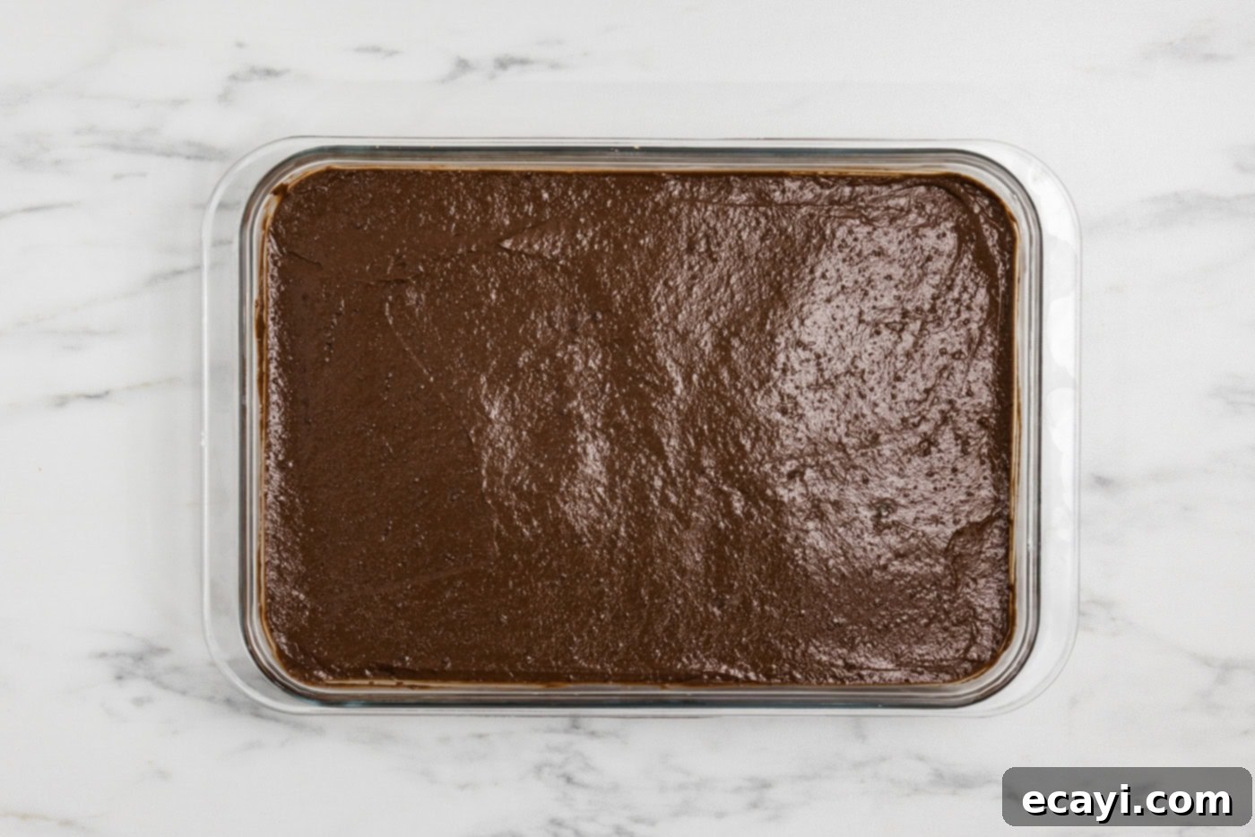 S'mores Lasagna 9 chocolate pudding layer over cheesecake and crust in a baking dish
