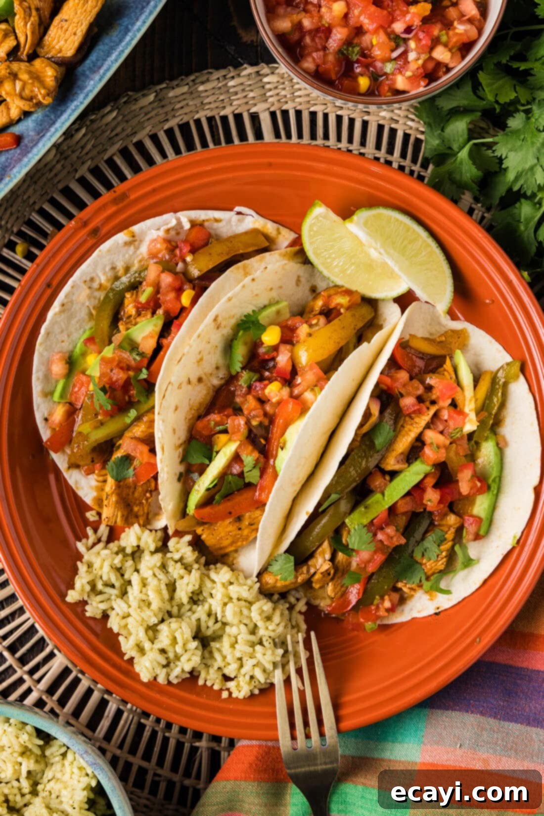 Sizzling Chicken Fajitas 3 Chicken Fajitas wrapped in tortillas on a plate