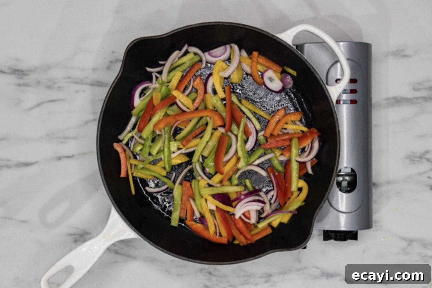Sizzling Chicken Fajitas 5 sauteeing bell peppers and onions in a skillet