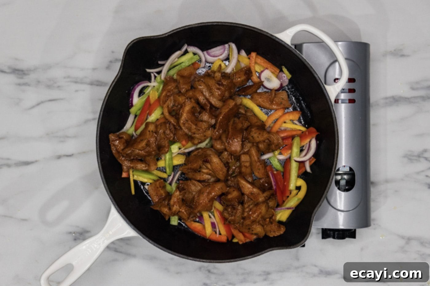 Sizzling Chicken Fajitas 6 fajita chicken added to skillet with bell peppers and onions