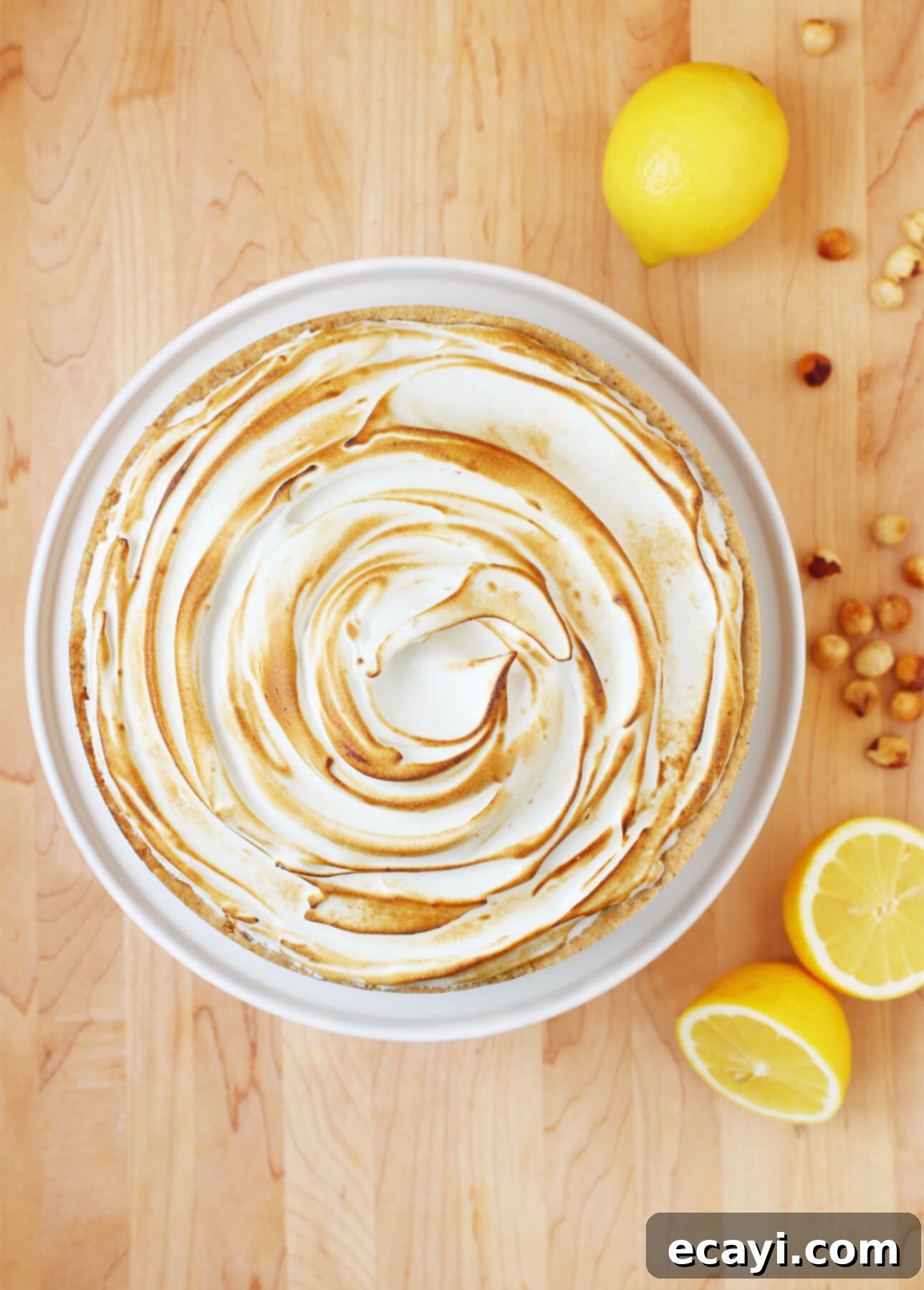 Ultimate Lemon Meringue Pie Simple Press-In Crust 5 How to Make a Perfect Lemon Meringue Pie: This Lemon Meringue Pie recipe will create a truly memorable dessert: the easy, cookie-like hazelnut crust combined with the zesty filling and creamy Italian meringue will delight all fans of this classic dessert. Helpful tips and how-to video included! // FoodNouveau.com