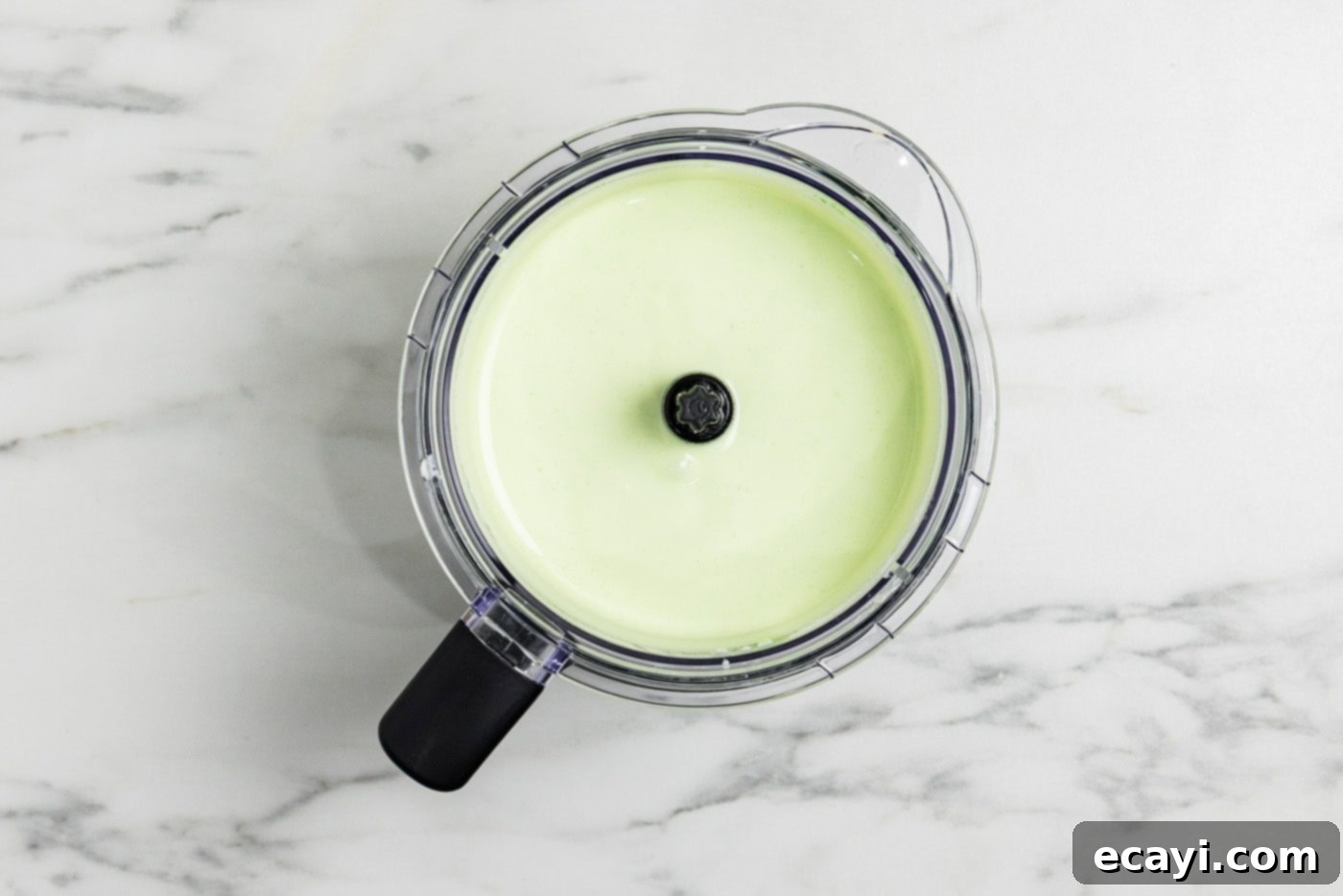 Tangy Keto Lime Cheesecake Minis 6 photo of blended keto cheesecake mixture in a food processor