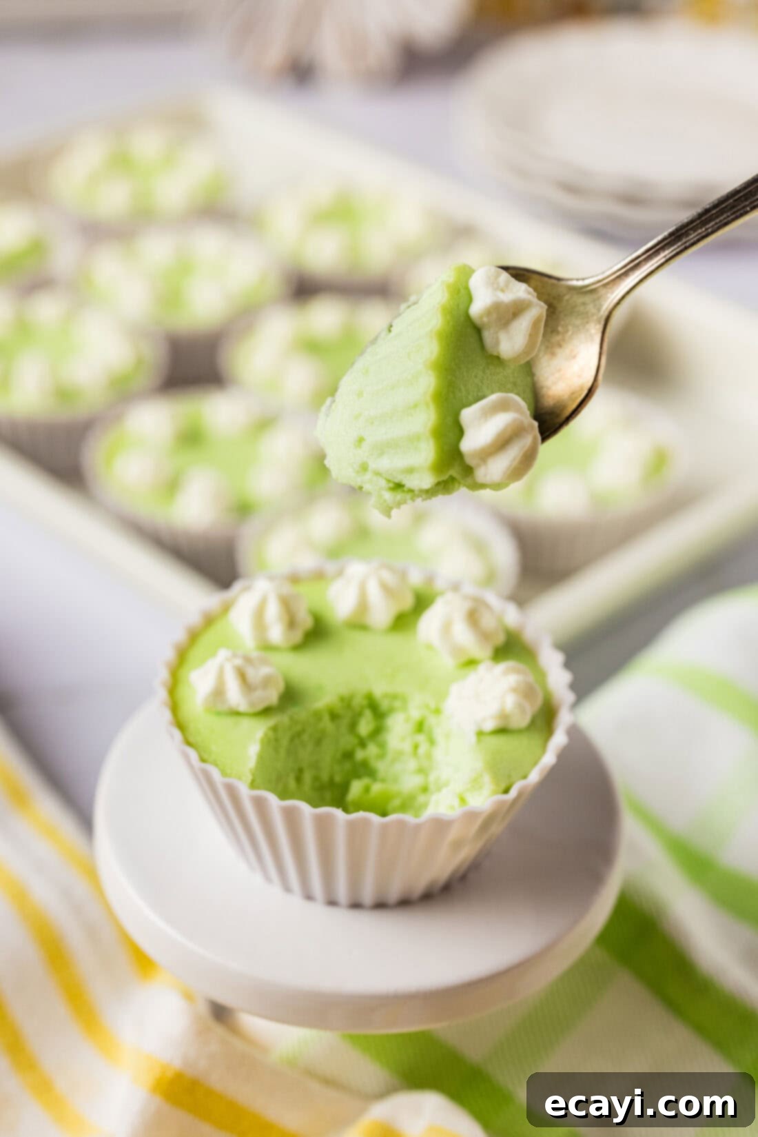 Tangy Keto Lime Cheesecake Minis 9 Spoonful of Keto Lime Cheesecake held above a cheesecake bite
