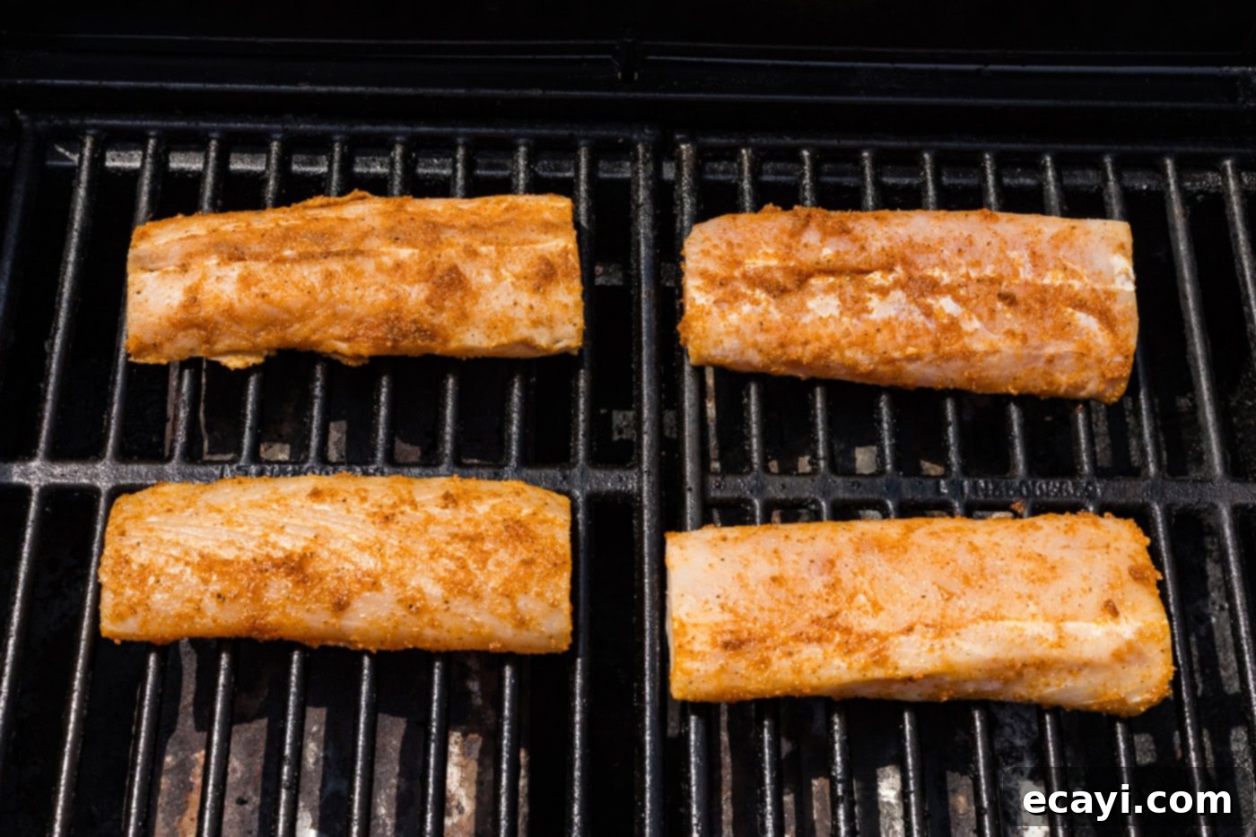 Succulent Grilled Mahi Mahi 7 seasoned mahi mahi filets on a grill