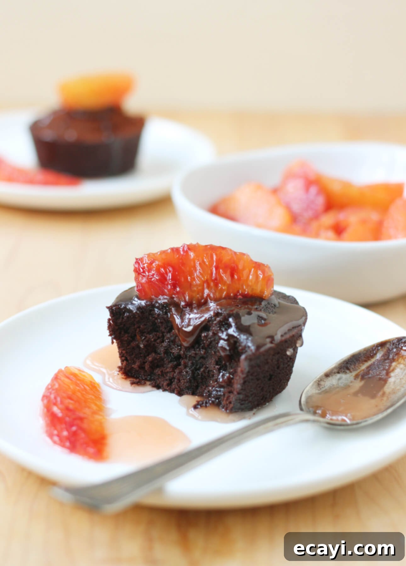 Decadent Blood Orange Chocolate Lava Cakes 4 A perfectly baked dark chocolate fondant cake with a glossy, rich surface, ready to be served.