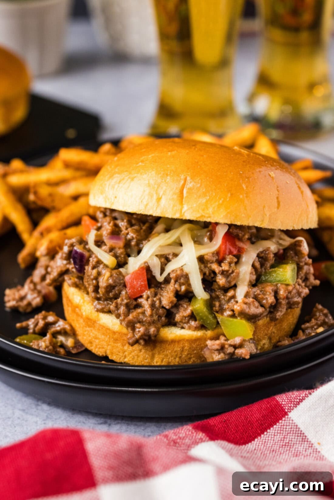 Philly Cheesesteak Messy Melts 2 Philly Cheesesteak Sloppy Joe on a plate with crispy french fries