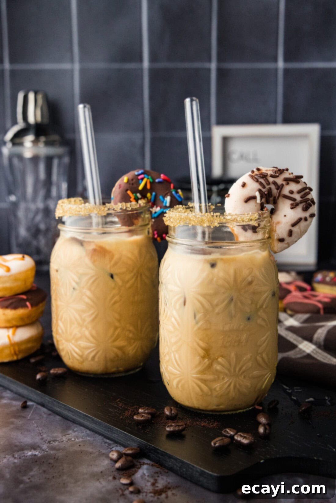 Velvet Espresso Chill 10 Two beautifully presented Iced Espresso Cocktails, each garnished with a mini donut, suggesting a perfect sweet treat pairing.